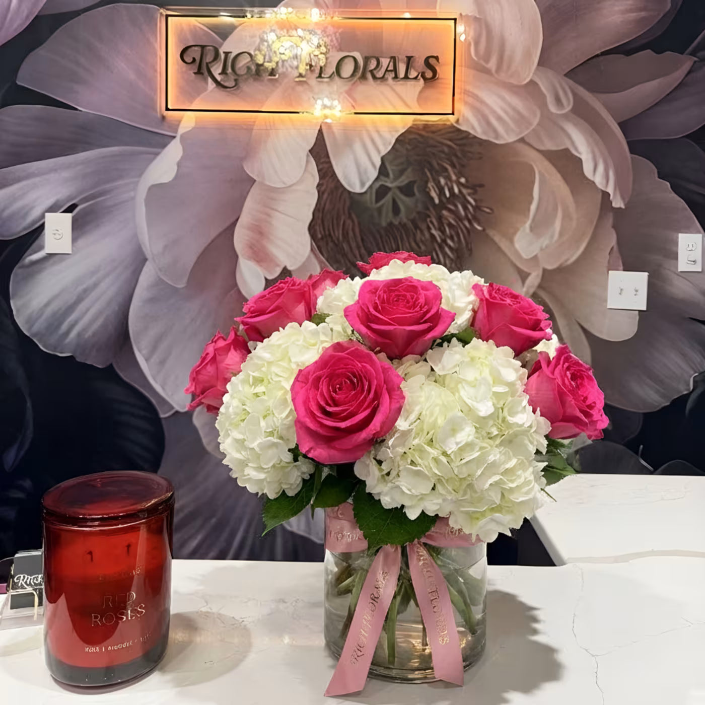 Pink Clouds vase arrangement with hot pink roses and white hydrangeas in clear glass vase by Rich Florals, Woodbridge NJ
